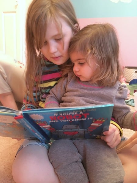 Lizzie reading to her friend