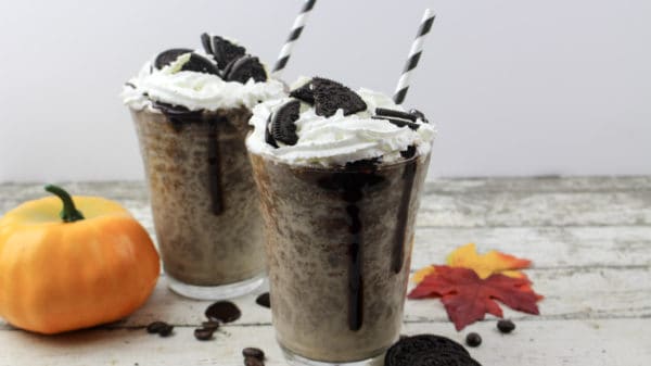 Two pumpkin mocha iced coffee drinks with Oreo cookies on top