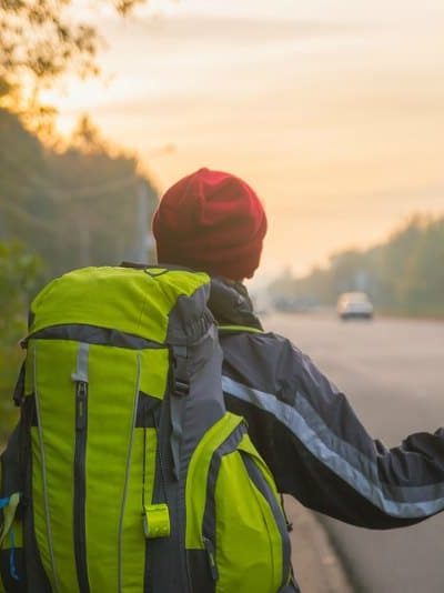 a hitchhiker at sunset