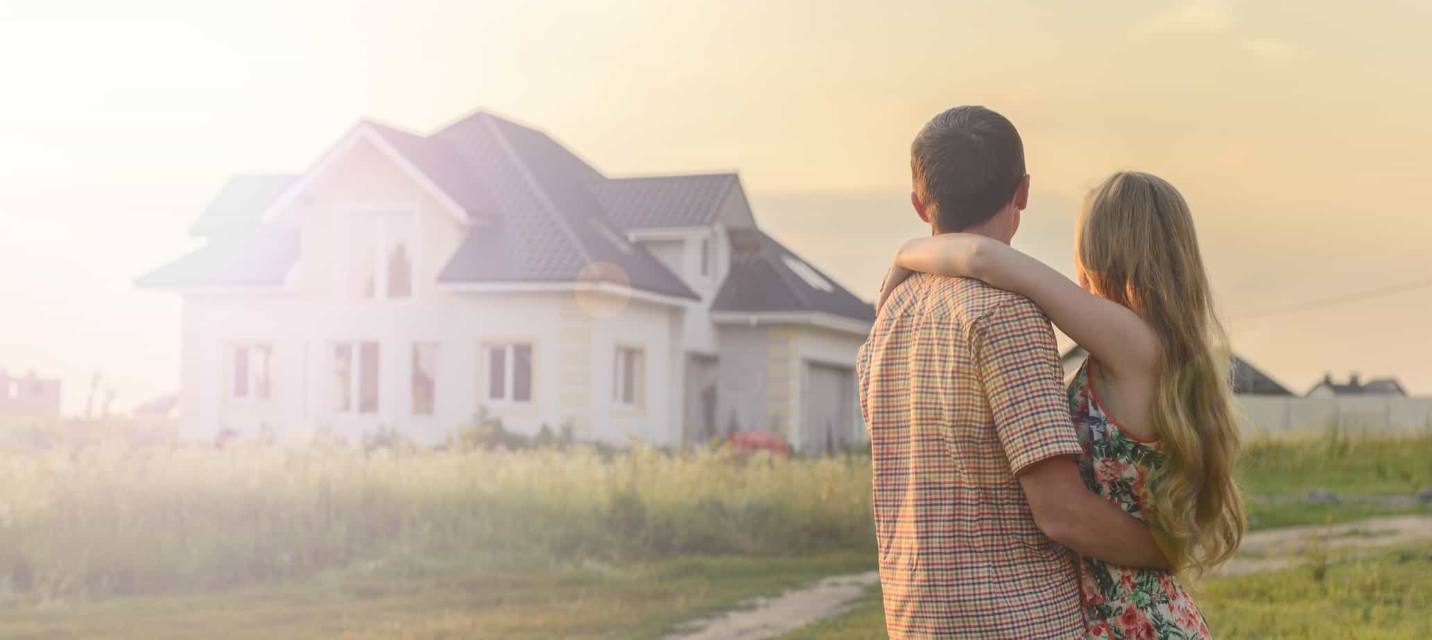 a man and woman looking on house
