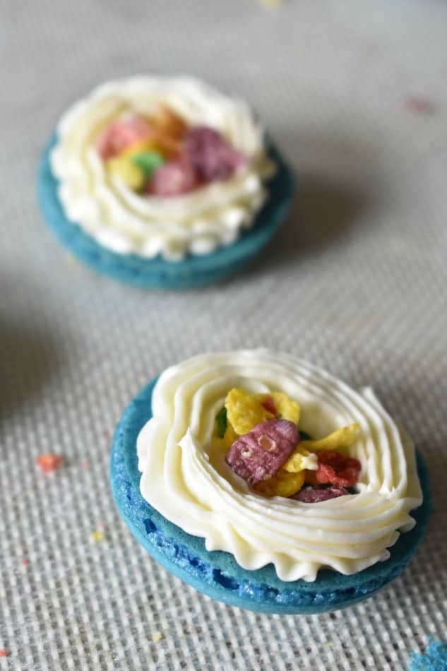 Add Fruity Pebbles in the middle of the macaron