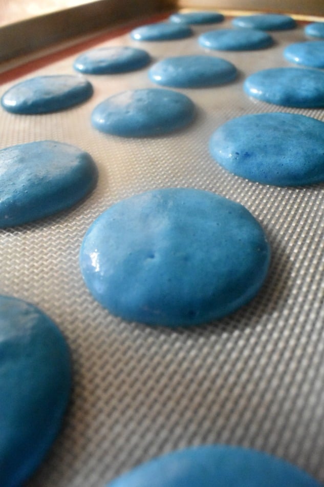 Blue Macaron Shells on a Baking Sheet