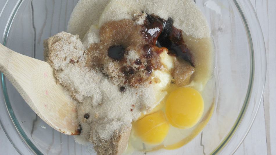 Brown sugar, vanilla and eggs in a mixing bowl