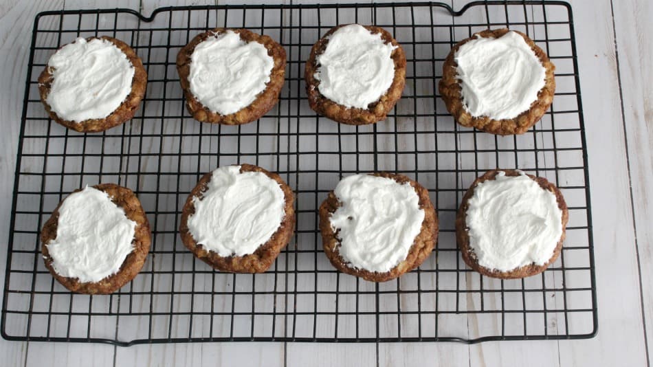 Put marshmallow topping on the oatmeal cookies