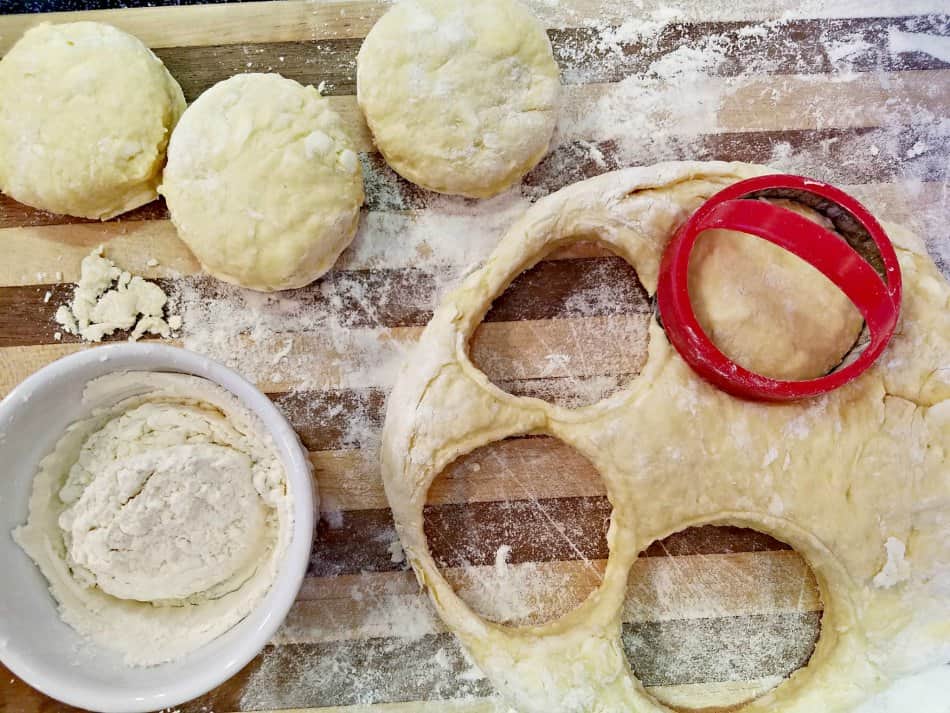 Cutting buttermilk biscuits out of dough