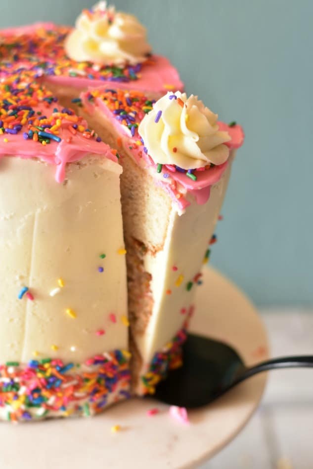 Slicing a funfetti cake