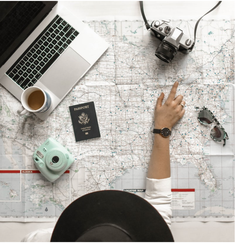 A person pointing to a map. 