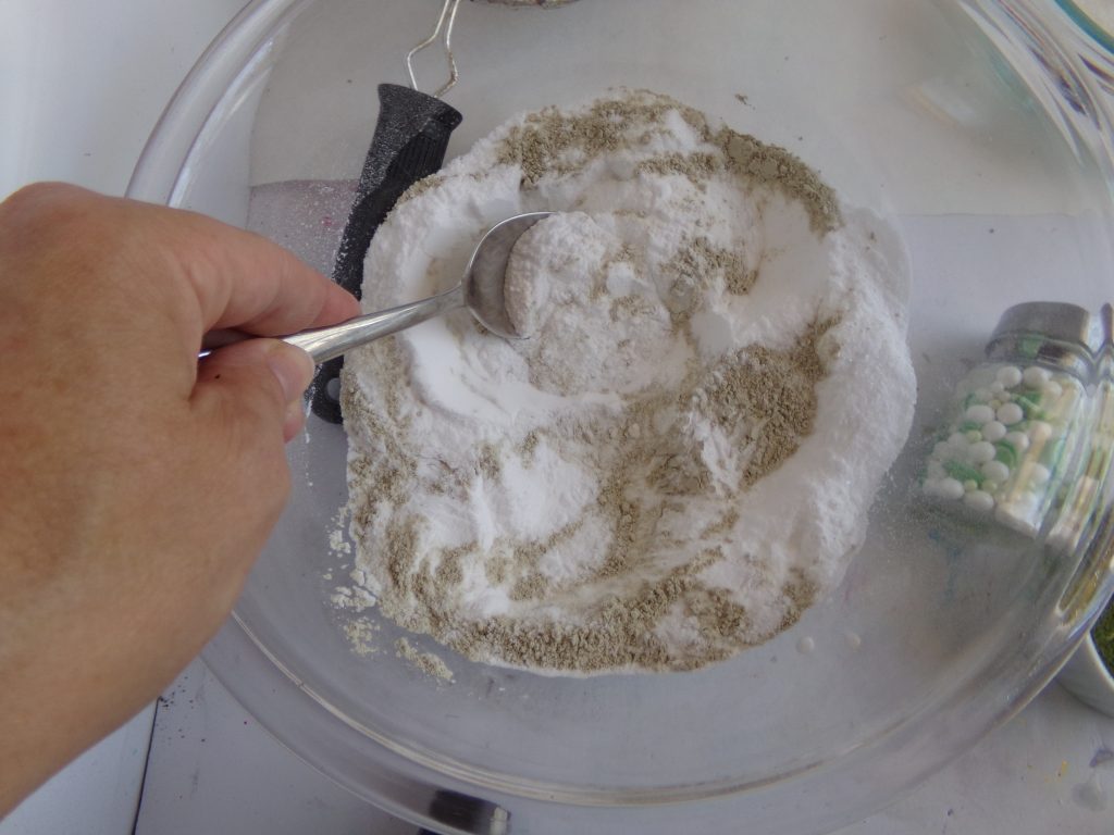 Mixing bath bomb dry ingredients together 