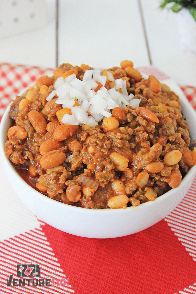 Sweet chili in a bowl with diced onions on top