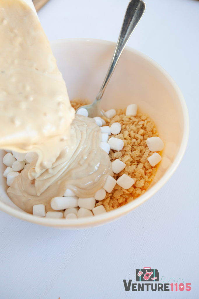 Pouring wet ingredients over the dry ingredients for avalanche cookies 