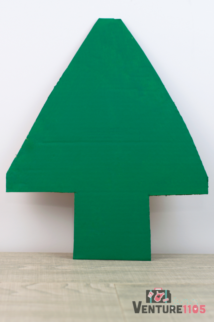 A green piece of cardboard shaped like a tree. 