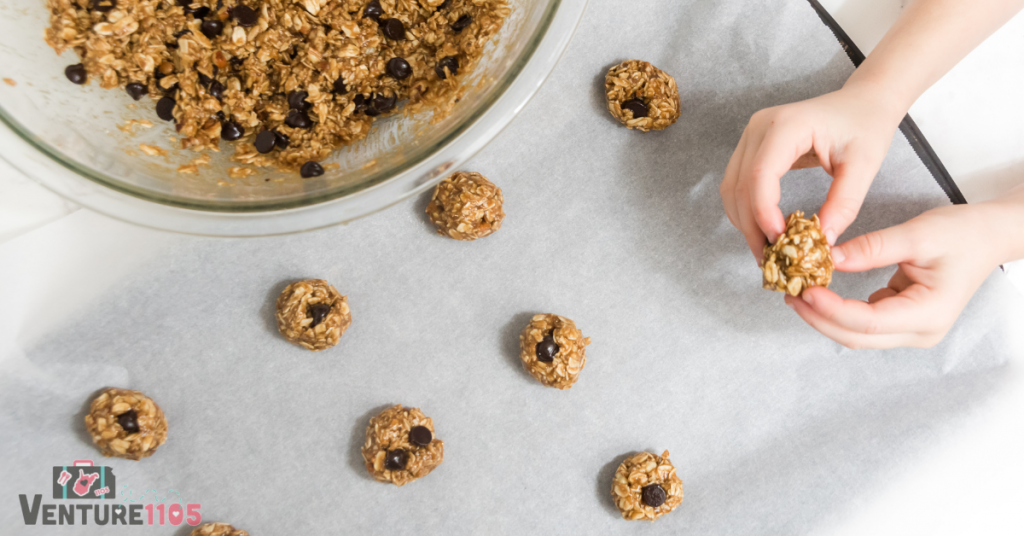 Adding cookie dough to the baking sheet 