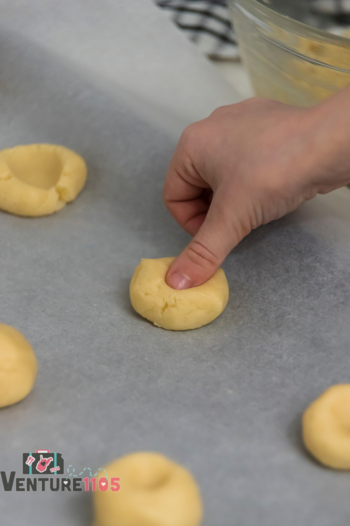 Making thumbprints in the dough