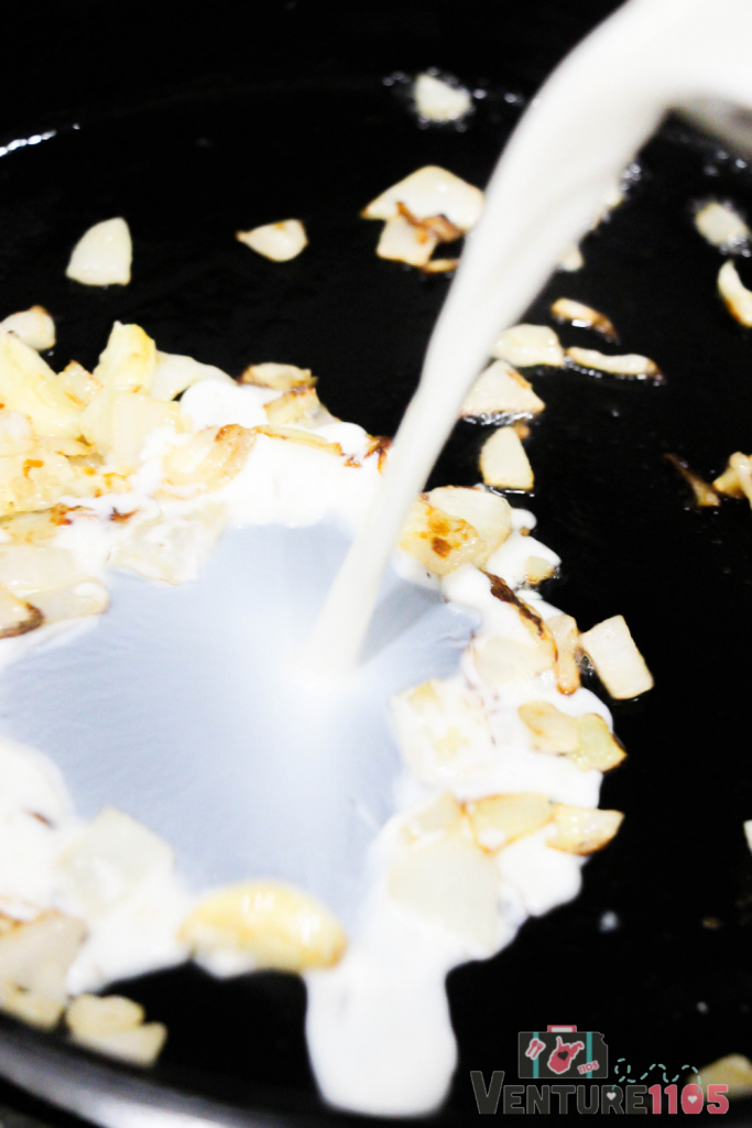 Adding milk to onions