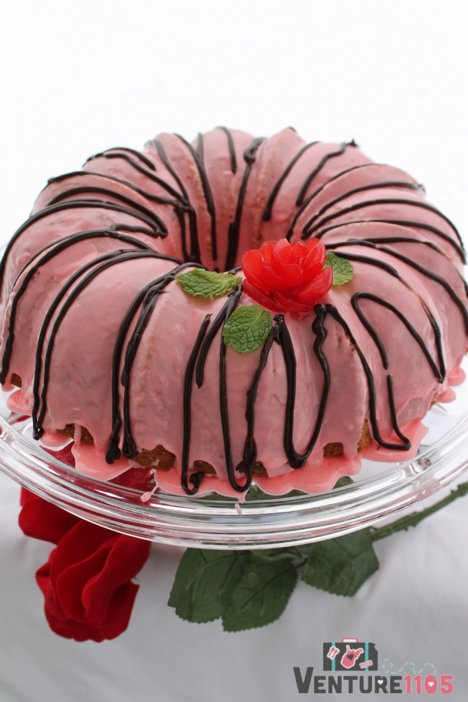 A bundt cake with cherry glaze