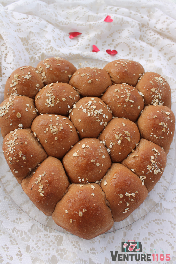 A plate of sweet rolls in the shape of a heart