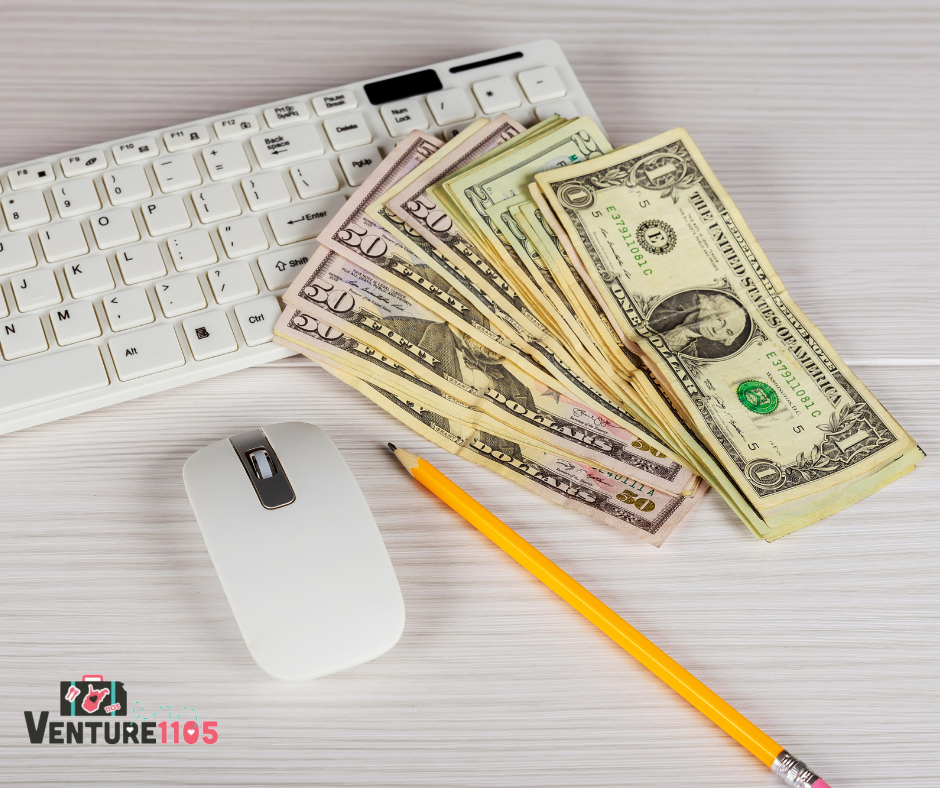 Money next to a computer keyboard 