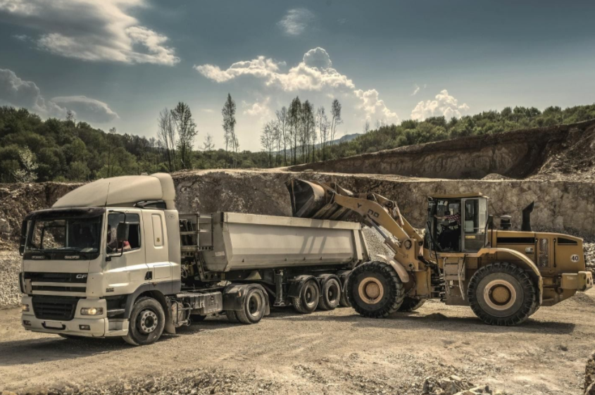 A dump truck and a front end loader