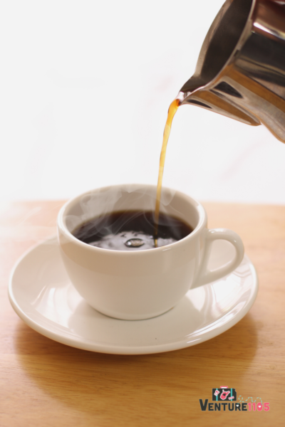 Pouring Coffee Into A Coffee Cup