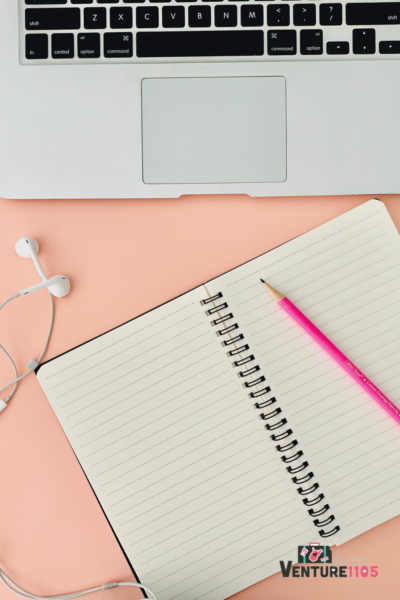 A laptop and notebook of a college student doing school online