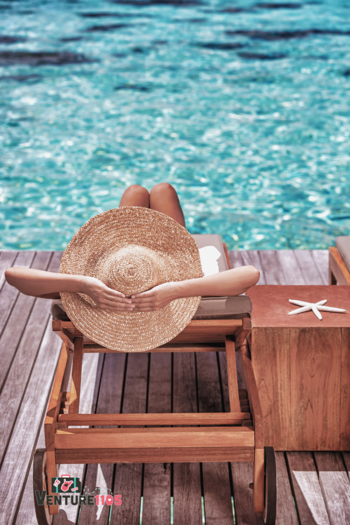 A woman sunbathing with a straw hat on
