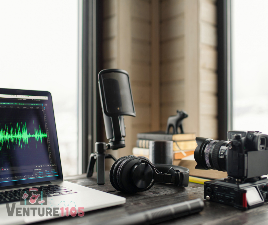A laptop and other video editing equipment on a desk