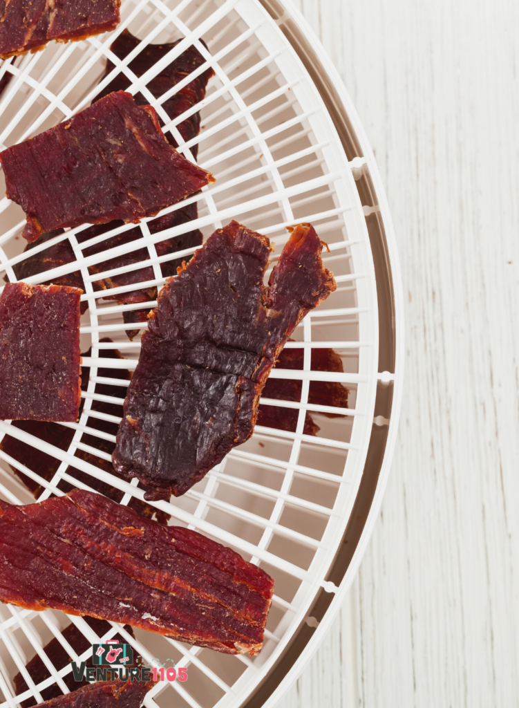 A food dehydrator with jerky on it