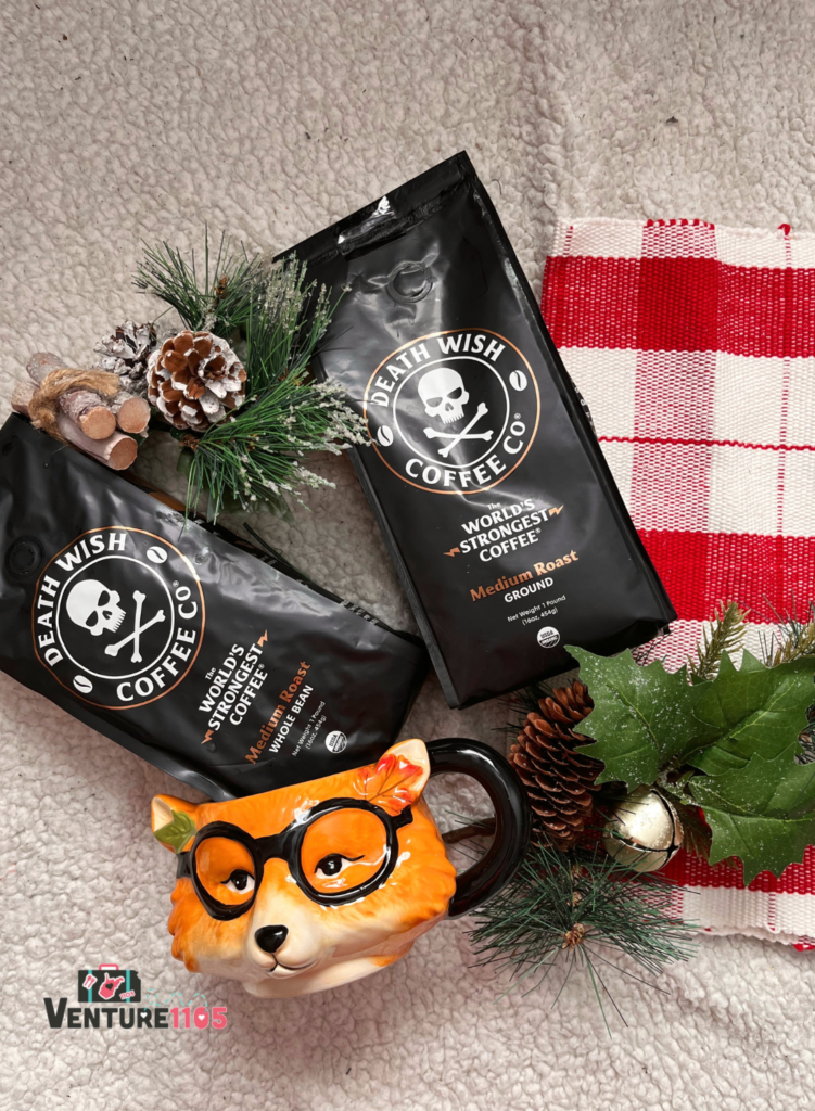 Two bags of Death Wish Coffee with a fox coffee mug