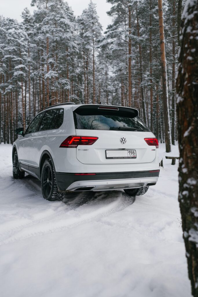 A white SUV in the snow