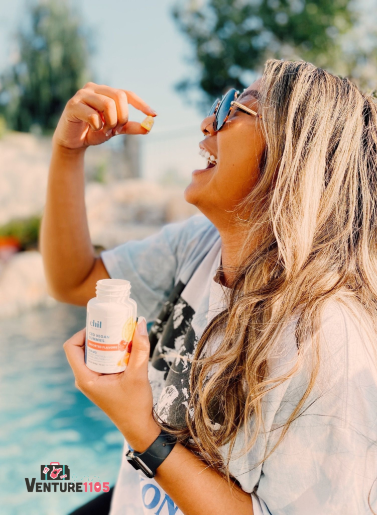 A girl about to eat a TCH Gummy