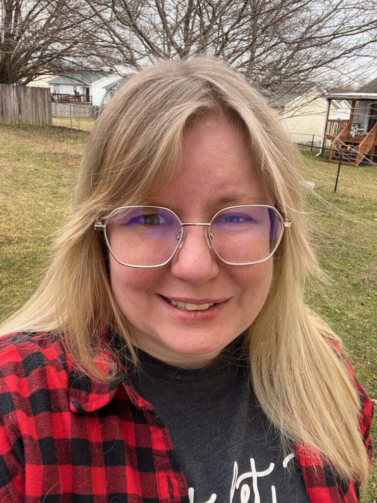 A woman smiling with lasting effects of Bell's Palsey called synkinesis