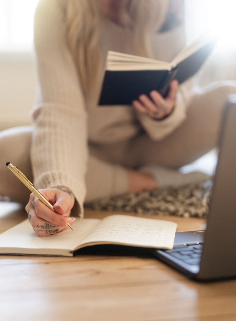 a girl writing in a notebook