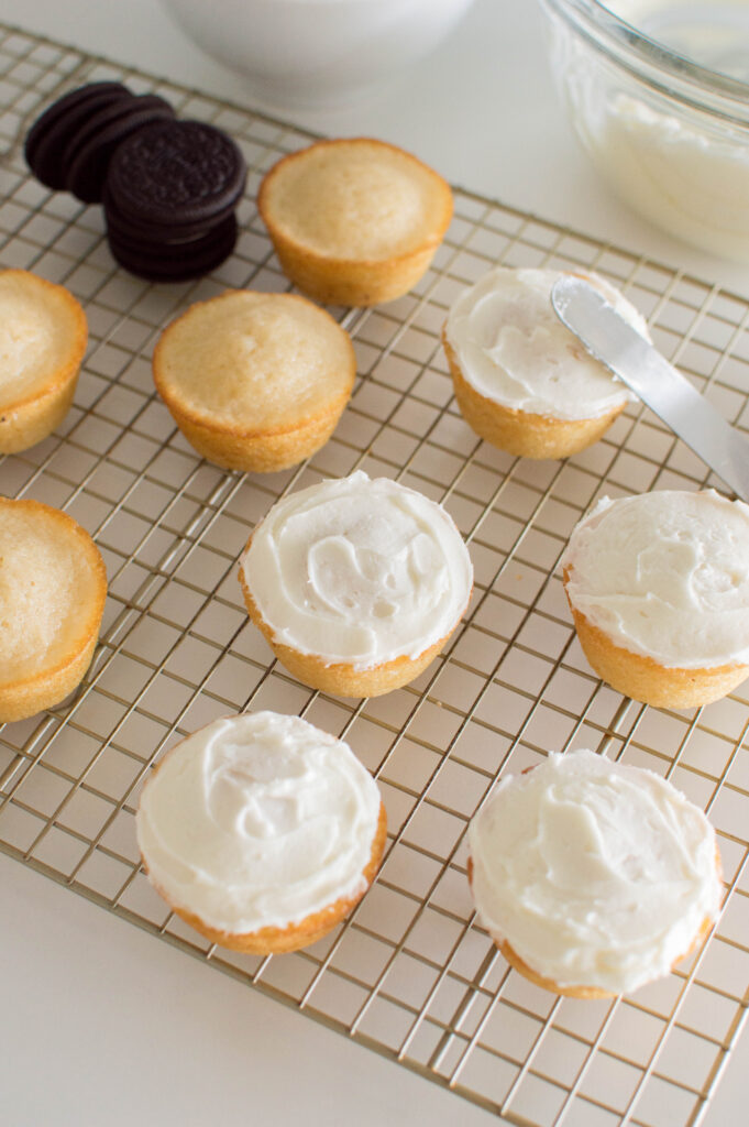 White cupcakes with vanilla frosting 